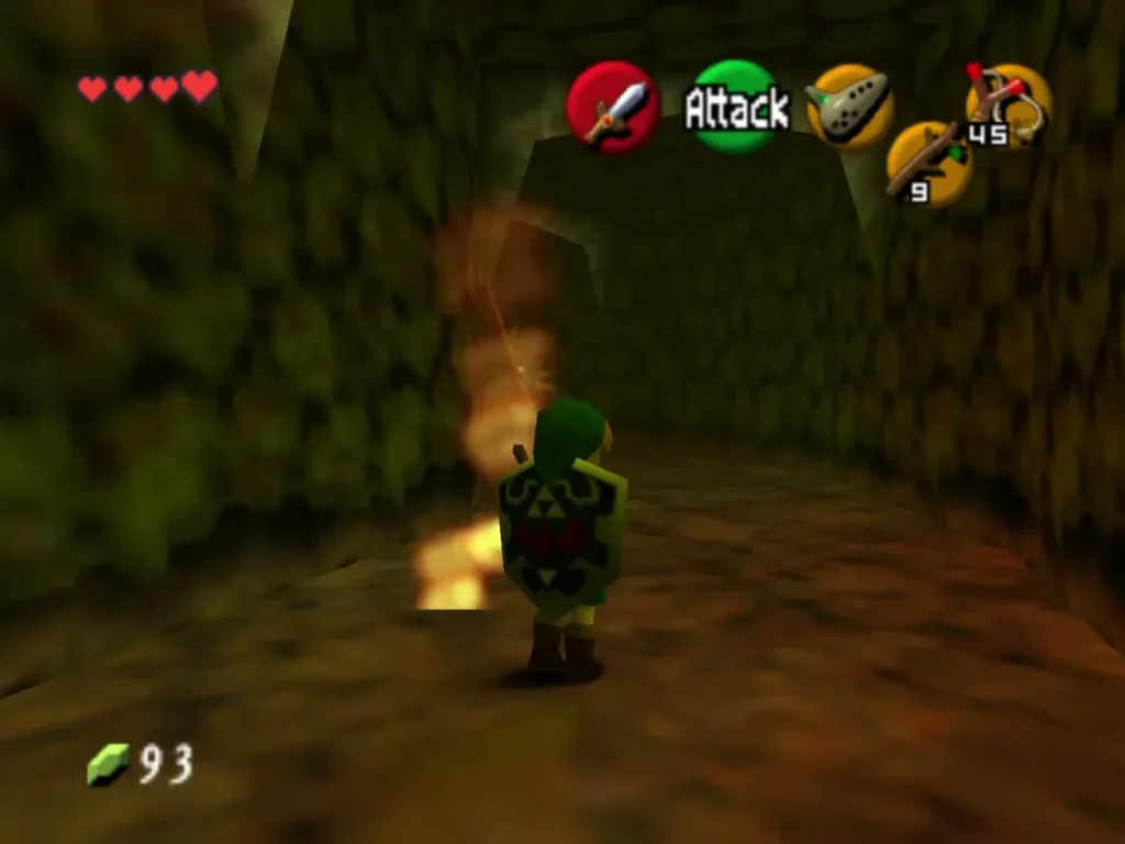 Link carrying a flaming Deku Stick down a narrow stone passage