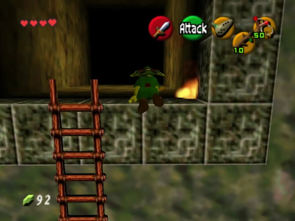Link standing on a stone ledge above a ladder with a torch burning nearby