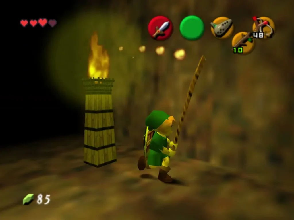 Link standing beside a lit torch with a Deku Stick in hand