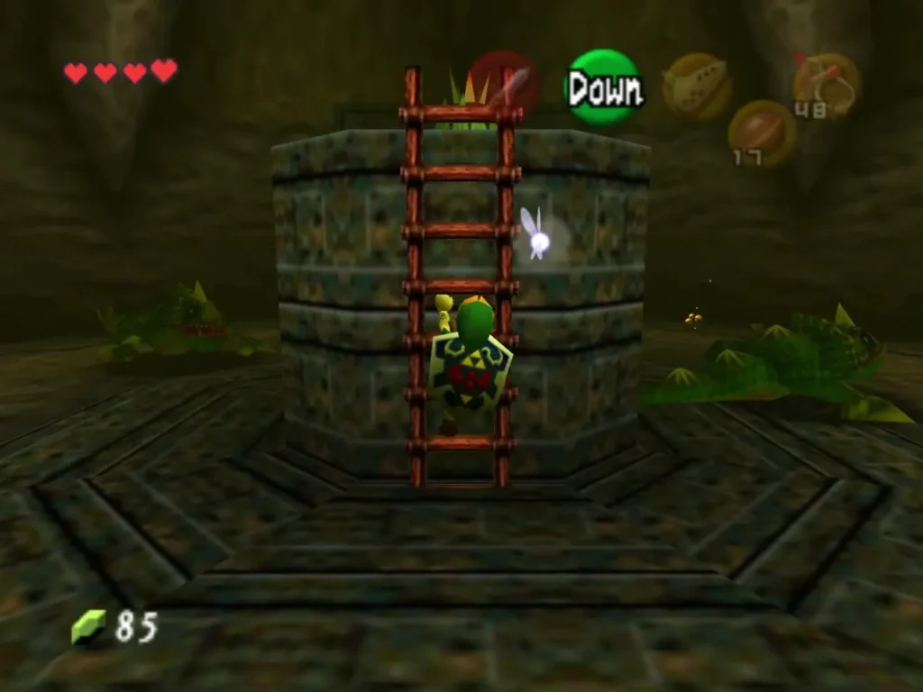 Link climbing the ladder up the central pillar of the round Dodongo room