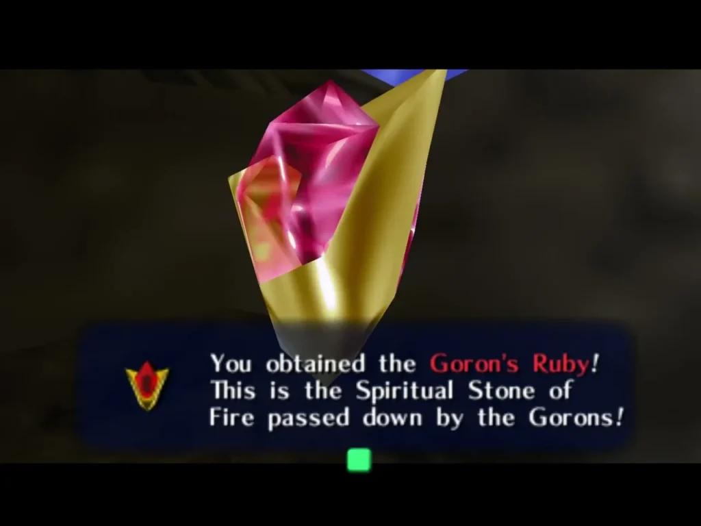 Link receiving the Goron's Ruby, with its message box naming the Spiritual Stone of Fire