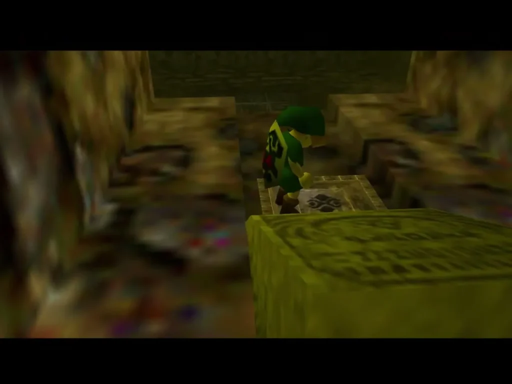 Link standing on a yellow stone block in the cavern corridor