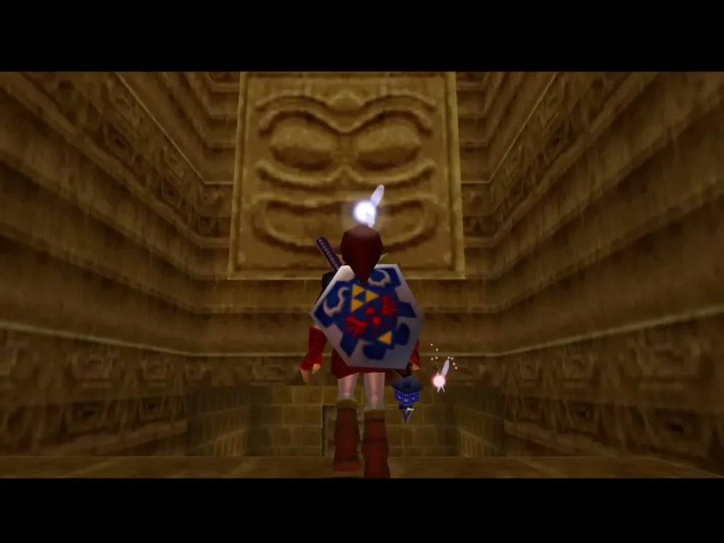 Link with shield facing a carved stone face set into the dungeon wall
