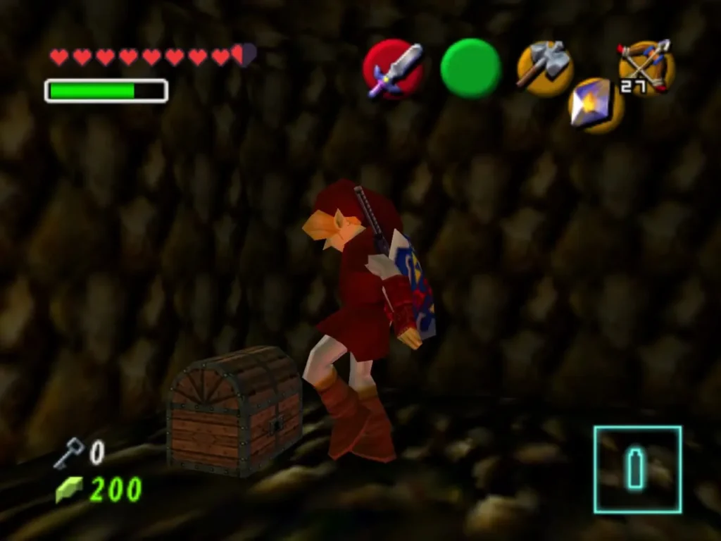 Link stands beside a chest in the dark stone corridor