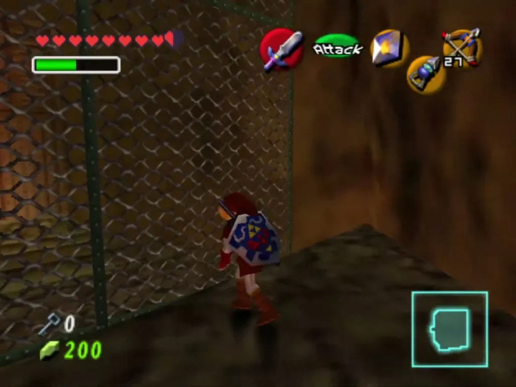 Link climbs a chain-link grate beside a stone wall