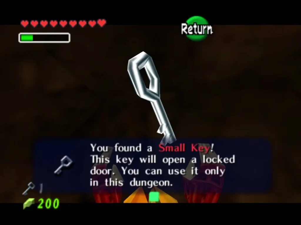 Link holds up the Small Key, with the You found a Small Key message box fully shown