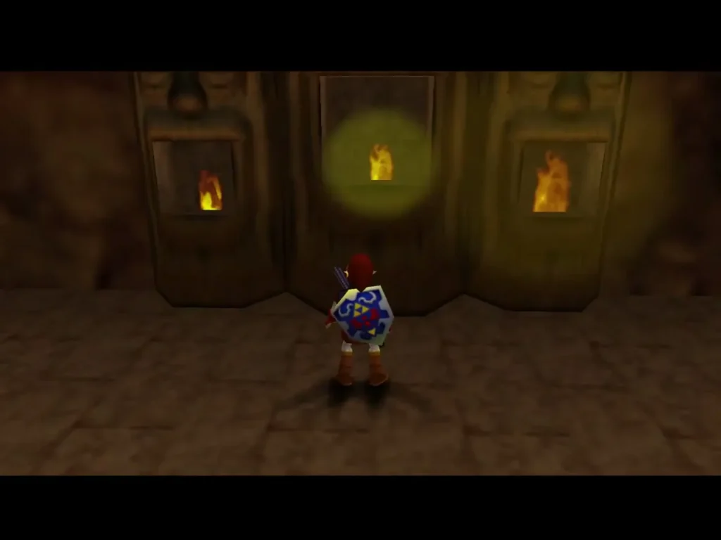 Link faces the carved wall where fire burns in the statue alcoves