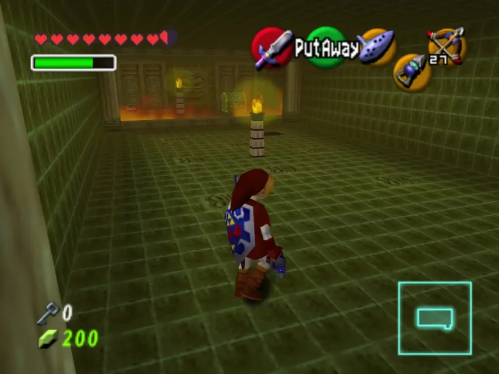 Link walks the green-tiled room with torches burning ahead