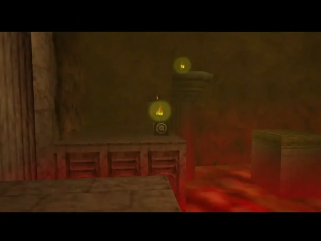 Lit torches glow on ledges across the lava room of the Fire Temple
