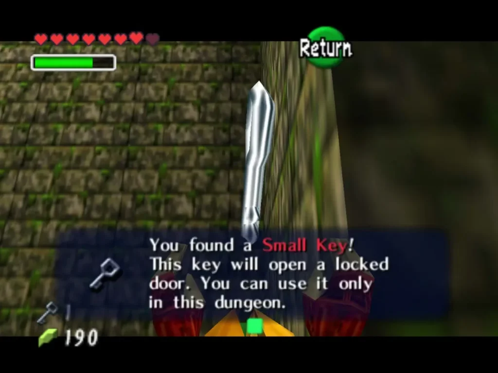 Item box reading You found a Small Key held up beside a stone wall