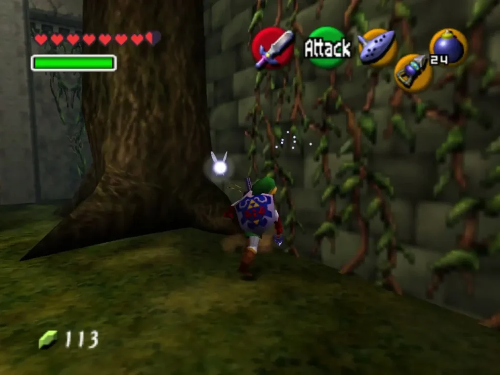 Link at the base of the tree beside the vine wall