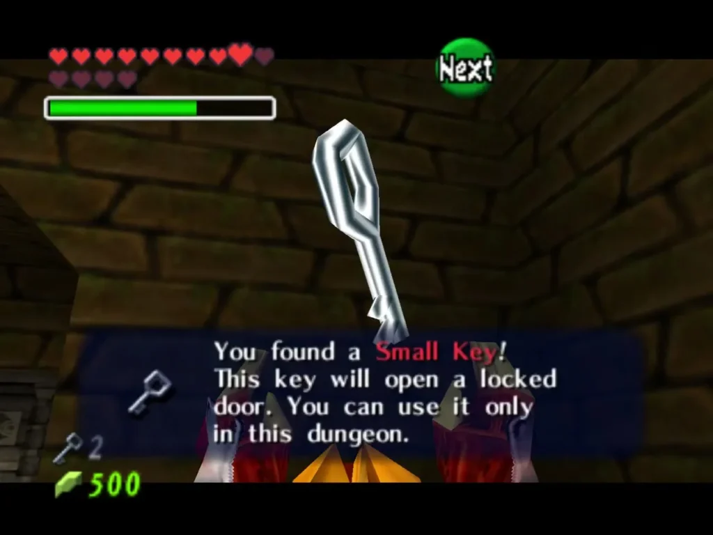 Link holding up a Small Key, with the item box naming it Link holding up a Small Key, with the item box naming it