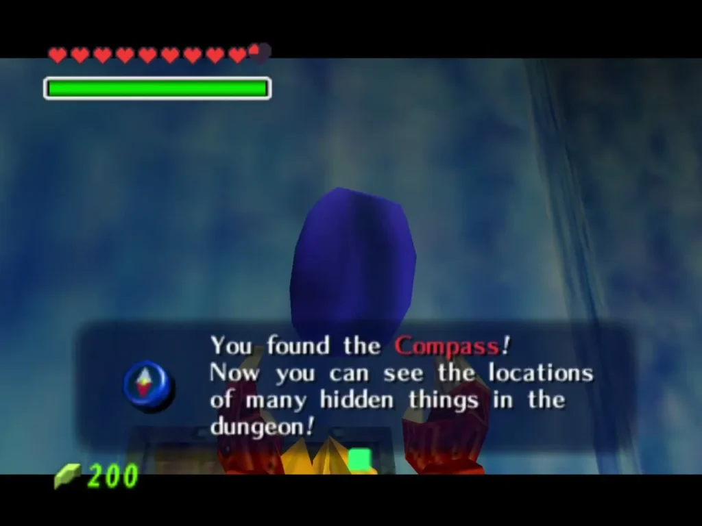 Link holding up the Compass with the You found the Compass message box in Ice Cavern Link holding up the Compass with the You found the Compass message box in Ice Cavern