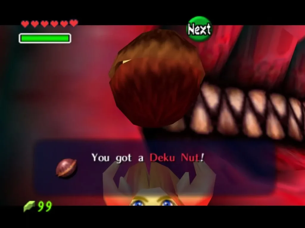 Link holding up a Deku Nut with its name box on screen Link holding up a Deku Nut with its name box on screen