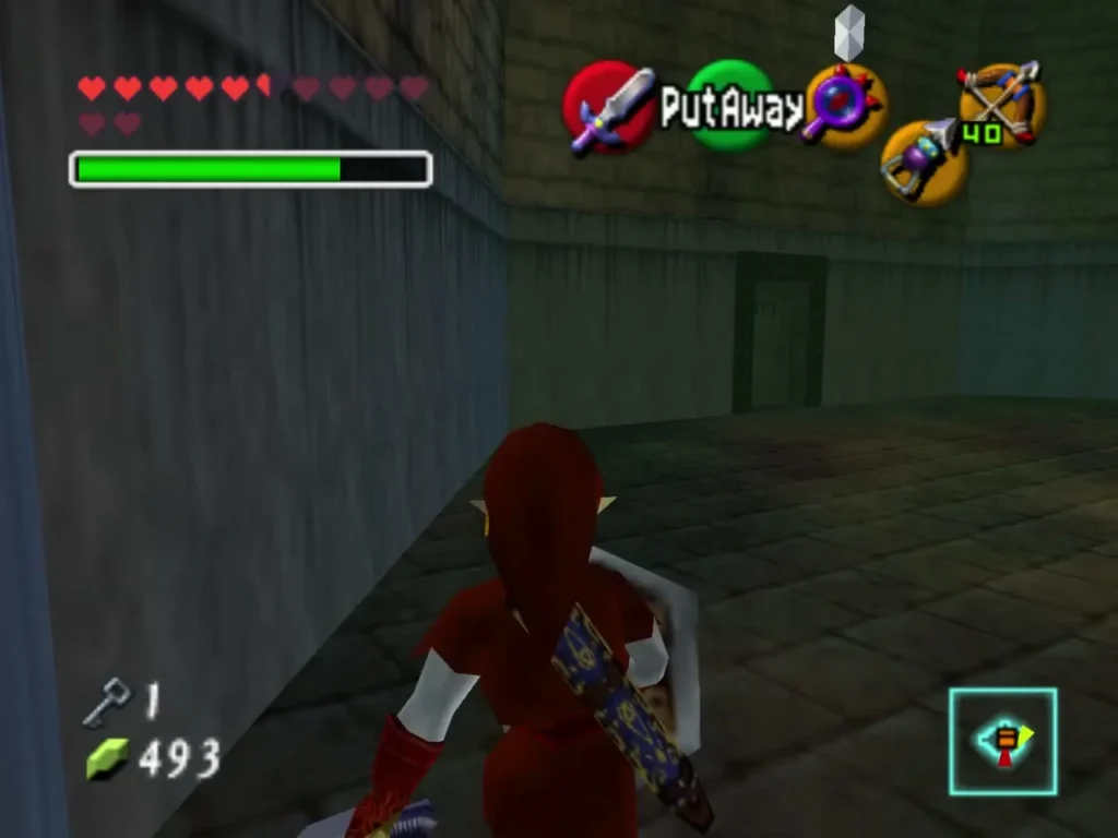 Link walking a stone corridor toward a door at its far end in Shadow Temple