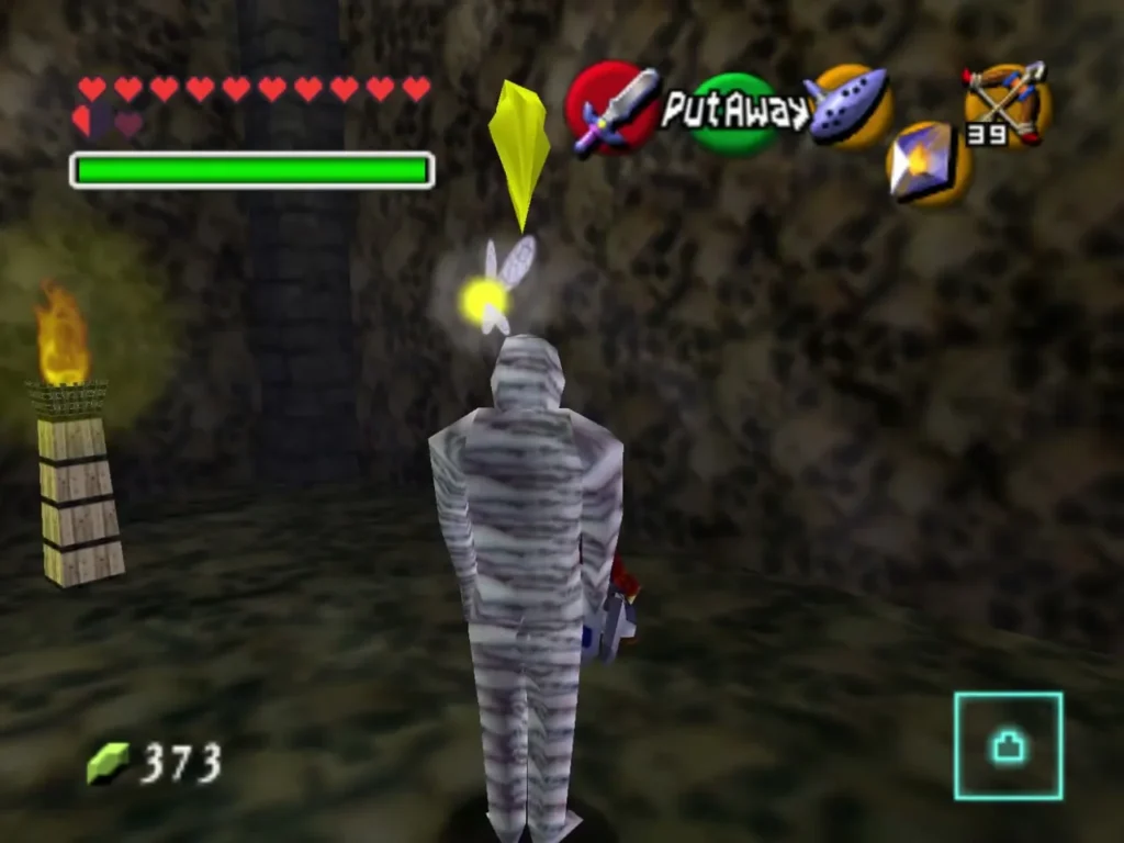 A bandaged Gibdo stands in a dim room as Link lines up a lock-on