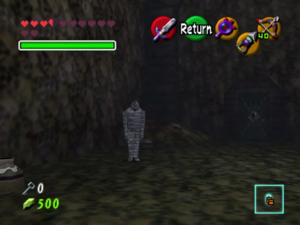 Two Gibdo mummies stand in a dim stone room with Link