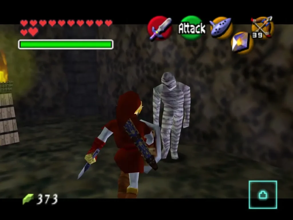 Link swinging his sword at a bandaged Gibdo mummy in a dim stone room