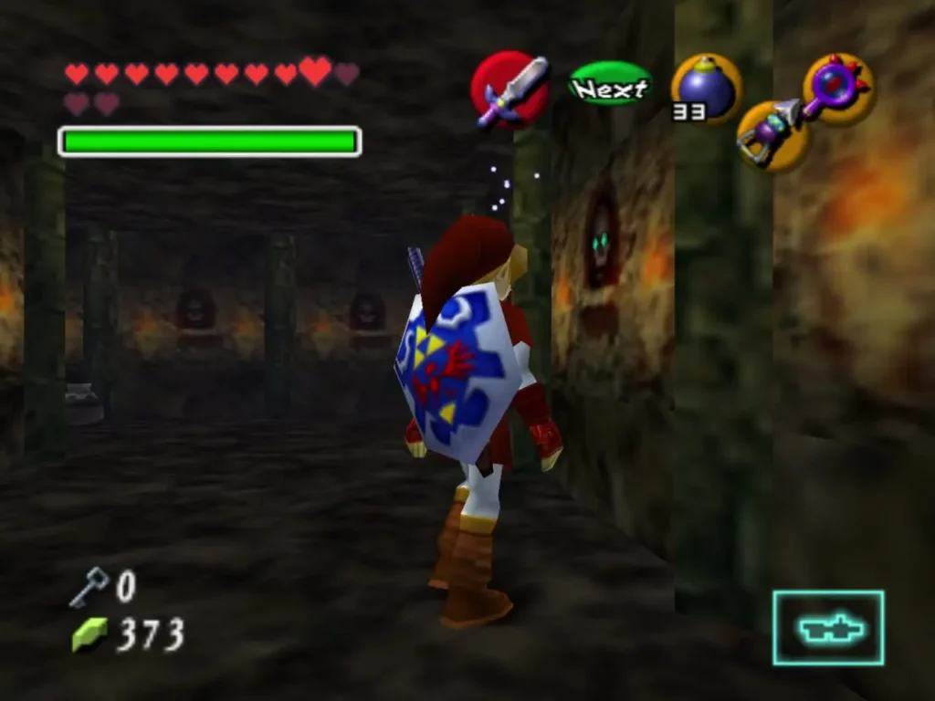 A glowing green eye in a carved wall face beside Link in the Shadow Temple hall