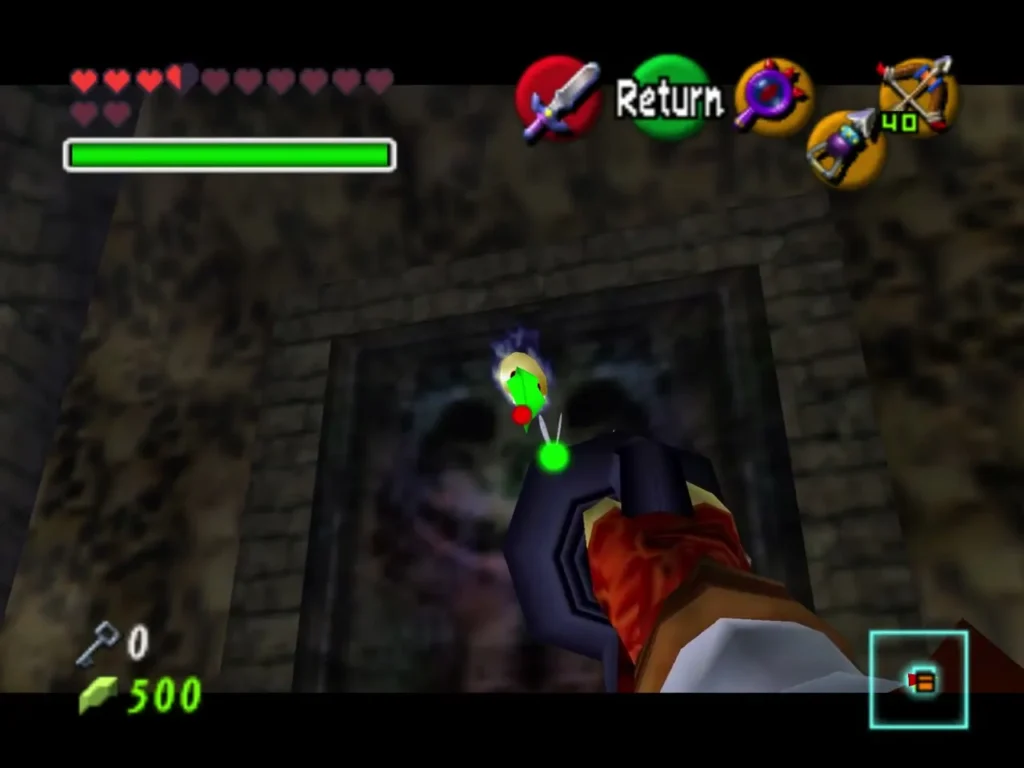 Link aiming the Longshot at a carved face in the wall of the Redead room