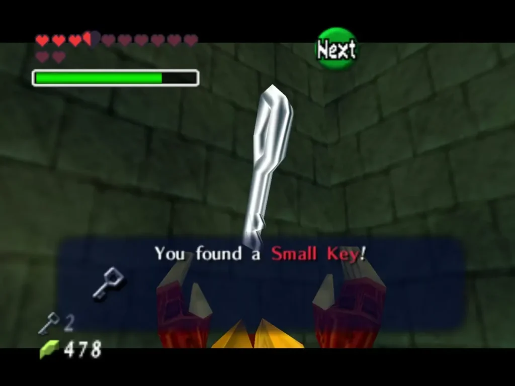 A Small Key floats between two red claws as the You found a Small Key message appears