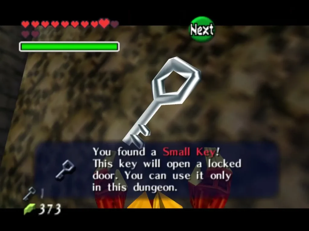Link holding up a Small Key as the message says it opens a locked door in this dungeon