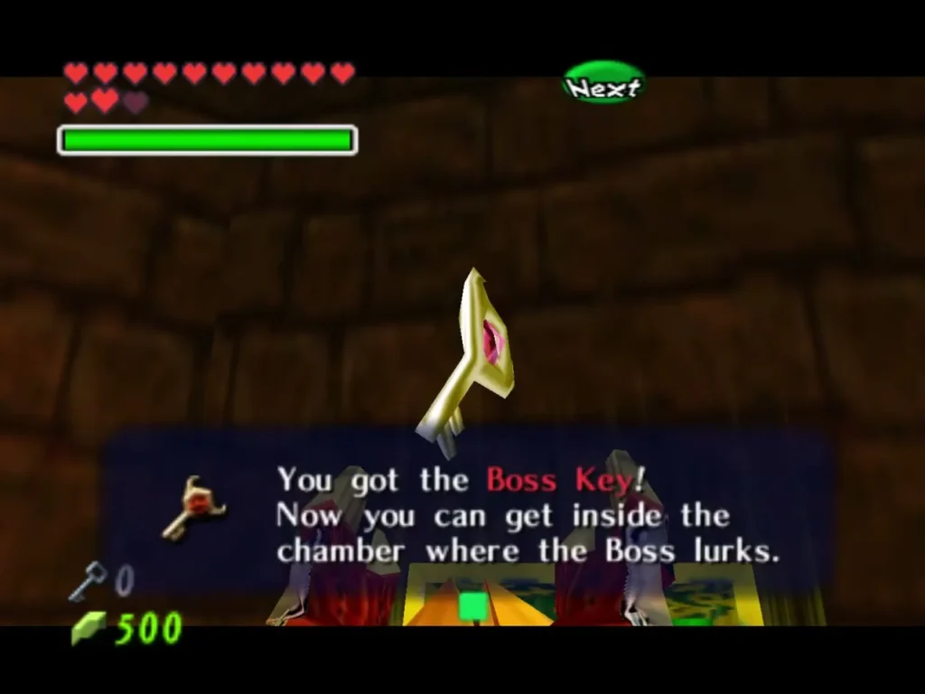 The Boss Key raised in the air, with its item box in the Spirit Temple The Boss Key raised in the air, with its item box in the Spirit Temple