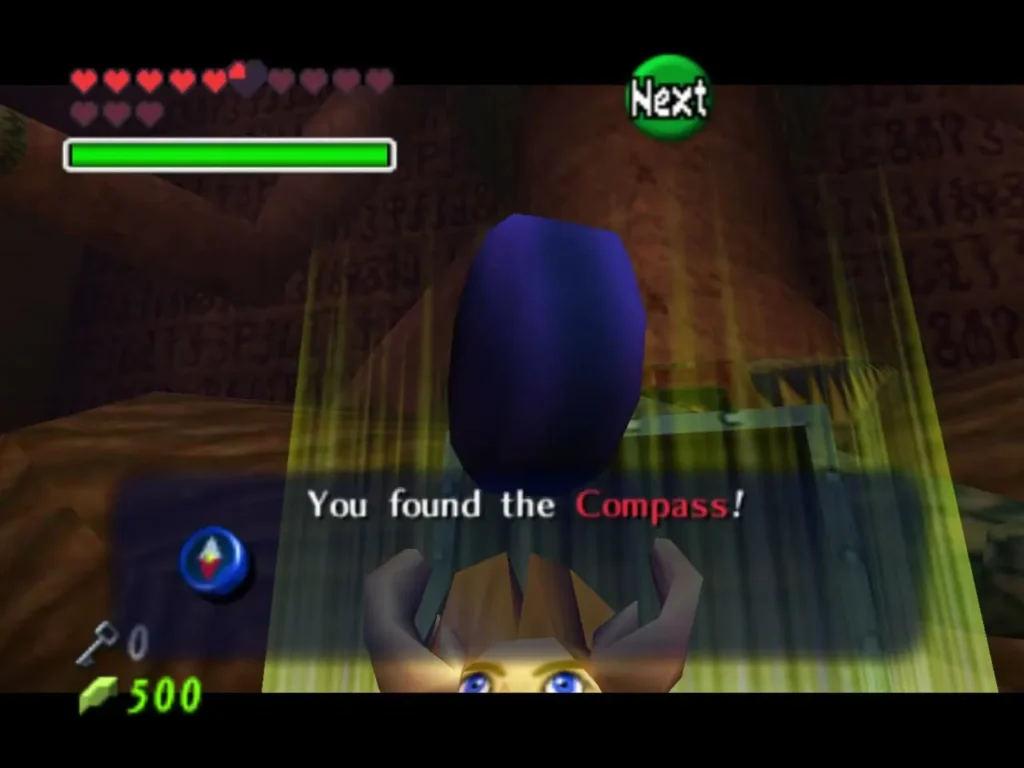 Link holding up the Compass with the You found the Compass message Link holding up the Compass with the You found the Compass message
