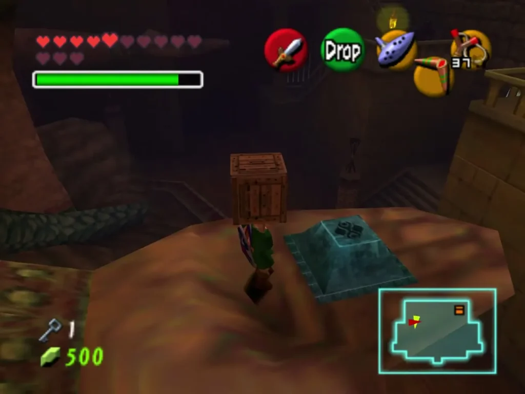 Wooden crate set down on the rock beside a teal floor switch Wooden crate set down on the rock beside a teal floor switch