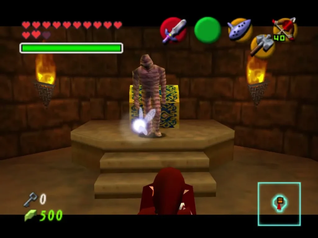 A Gibdo standing on a platform beside a golden chest in the Spirit Temple A Gibdo standing on a platform beside a golden chest in the Spirit Temple