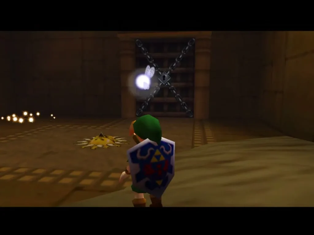Link with the Hylian Shield equipped in front of the chained door, beside a sun mark on the floor Link with the Hylian Shield equipped in front of the chained door, beside a sun mark on the floor