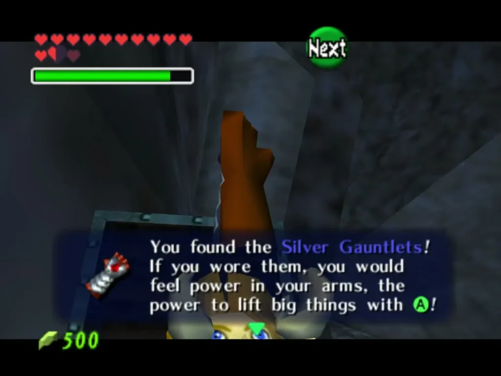 Link raising the Silver Gauntlets, with the item name box in the Spirit Temple Link raising the Silver Gauntlets, with the item name box in the Spirit Temple