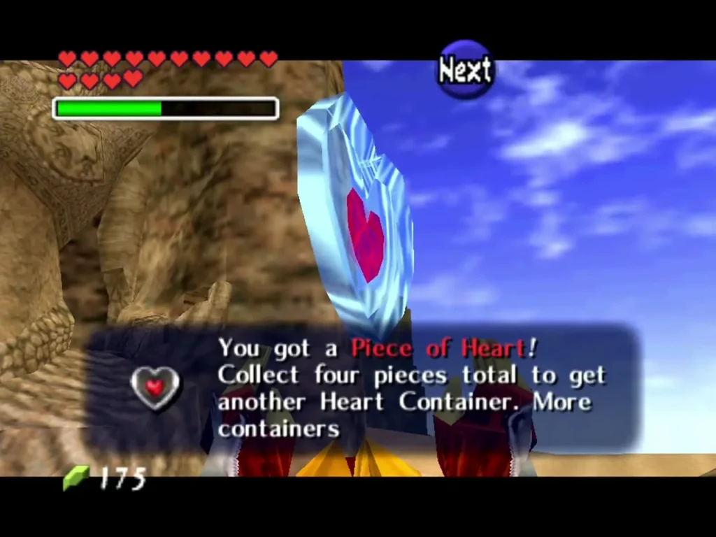 Link holding up the Piece of Heart found in the stone arch with the message box showing Link holding up the Piece of Heart found in the stone arch with the message box showing