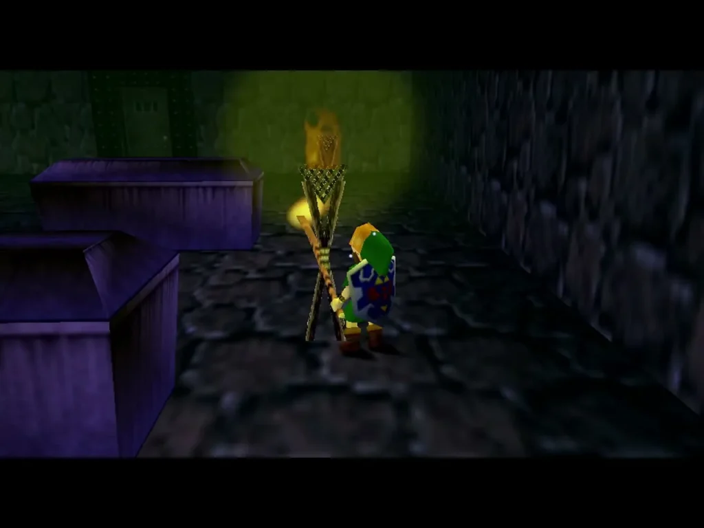Link beside a lit torch and a purple coffin in the Bottom of the Well coffin room