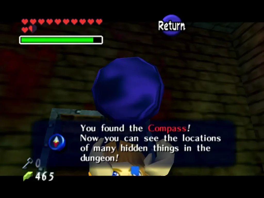 Link holding up the Compass with the 'You found the Compass!' box in Bottom of the Well