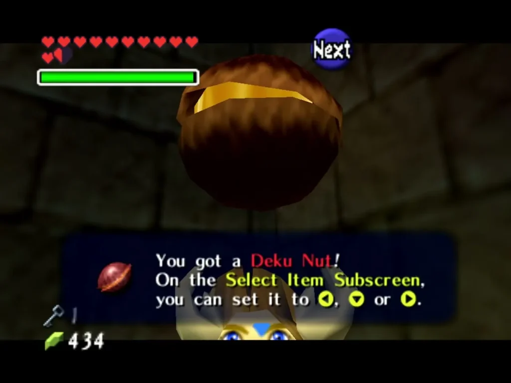Link holding up a Deku Nut with the You got a Deku Nut message box in the Bottom of the Well