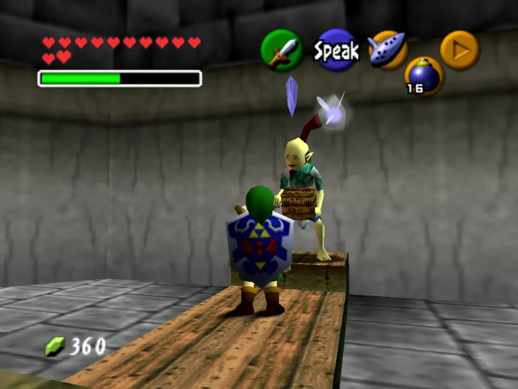 Link facing Guru-Guru on his platform in the windmill with the Speak prompt showing