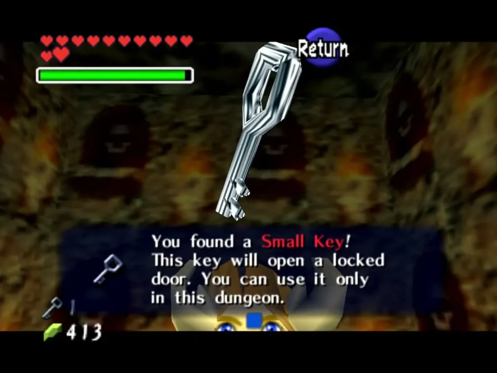 A Small Key held up with the You found a Small Key message box in the Bottom of the Well