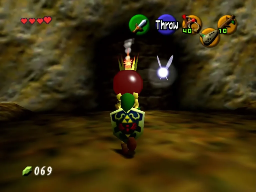 Link holding a Bomb Flower overhead with the Throw prompt showing Link holding a Bomb Flower overhead with the Throw prompt showing