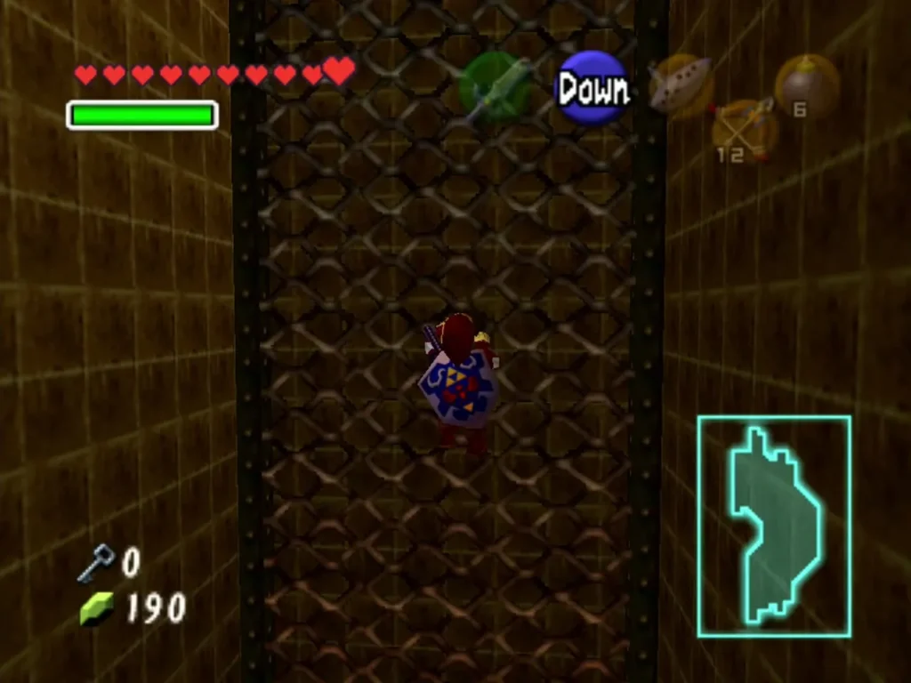 Link standing in front of a metal grate fence in the Fire Temple Link standing in front of a metal grate fence in the Fire Temple