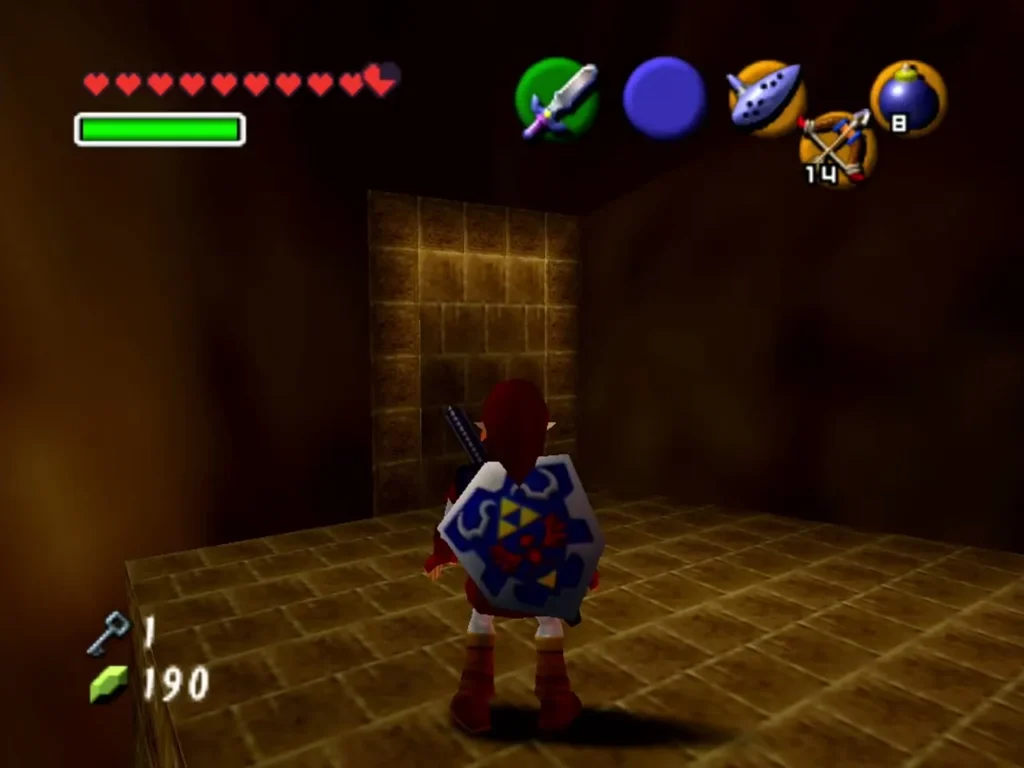Link facing a wall with bombs equipped in a dark Fire Temple corridor Link facing a wall with bombs equipped in a dark Fire Temple corridor