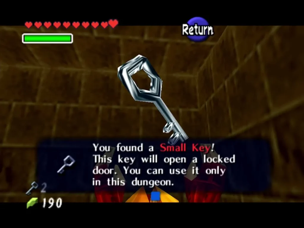 Link holding up a Small Key with the You found a Small Key box in the Fire Temple Link holding up a Small Key with the You found a Small Key box in the Fire Temple