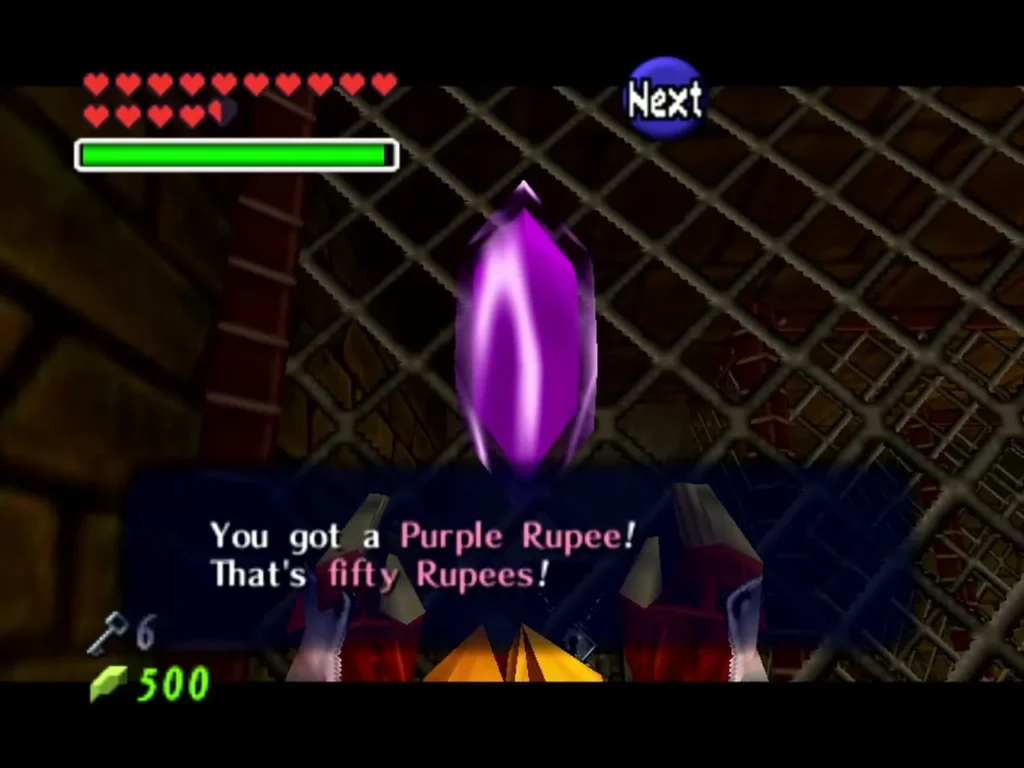 Link holding up a Purple Rupee with the message that it is worth fifty Rupees Link holding up a Purple Rupee with the message that it is worth fifty Rupees