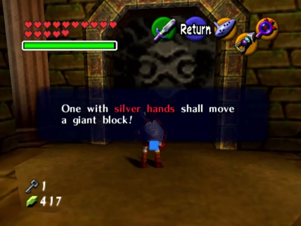 Message reading One with silver hands shall move a giant block, in front of a carved door Message reading One with silver hands shall move a giant block, in front of a carved door