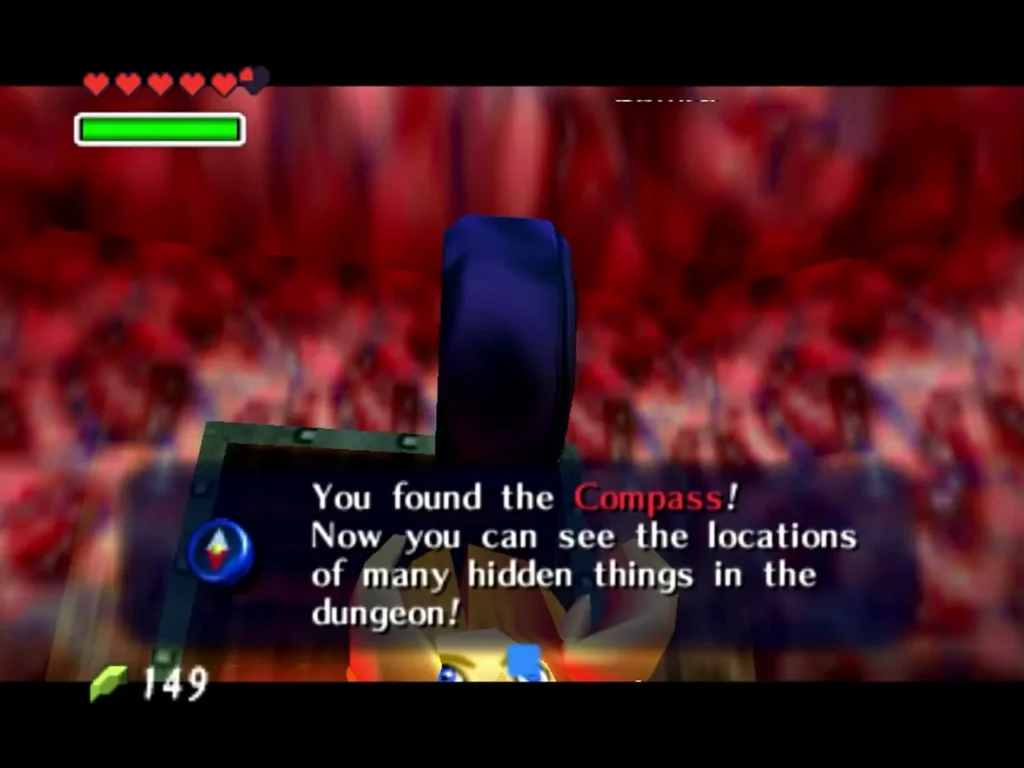 Link raising the Compass after the chest opens, with the You found the Compass box