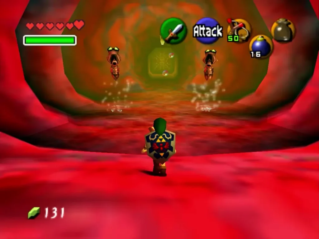 Link facing two enemies in the red tunnel inside Jabu-Jabu's mouth