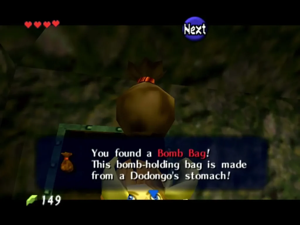 Link holding up the Bomb Bag found in a chest in Dodongo's Cavern with the full message shown Link holding up the Bomb Bag found in a chest in Dodongo's Cavern with the full message shown