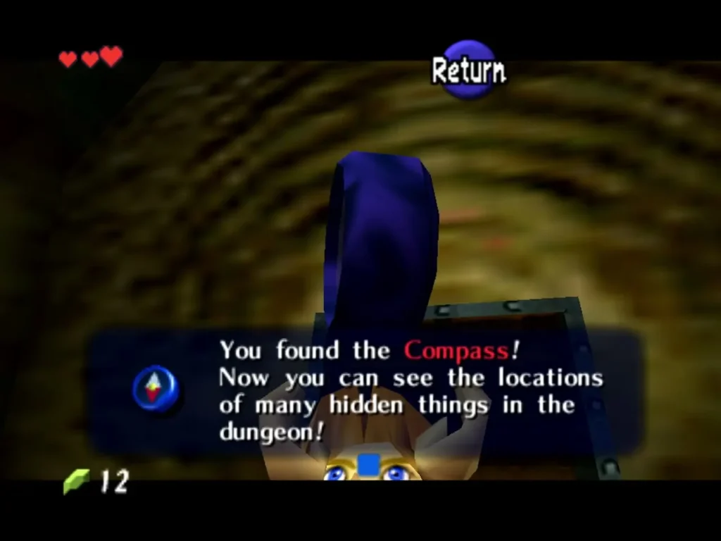Link holding up the Compass with its item message in the Deku Tree Link holding up the Compass with its item message in the Deku Tree