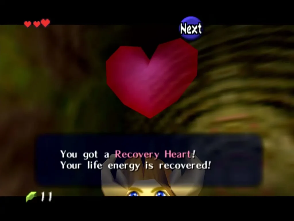 Link receiving a Recovery Heart from a small chest in the Deku Tree Link receiving a Recovery Heart from a small chest in the Deku Tree