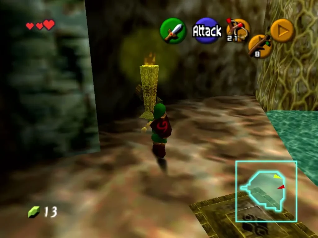 Link beside the lit torch on the ledge inside the Great Deku Tree Link beside the lit torch on the ledge inside the Great Deku Tree